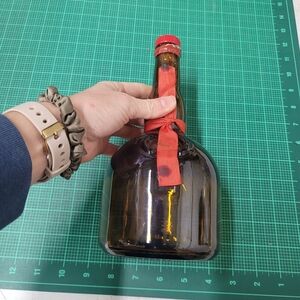 Amber Glass Bottle with Red Ribbon